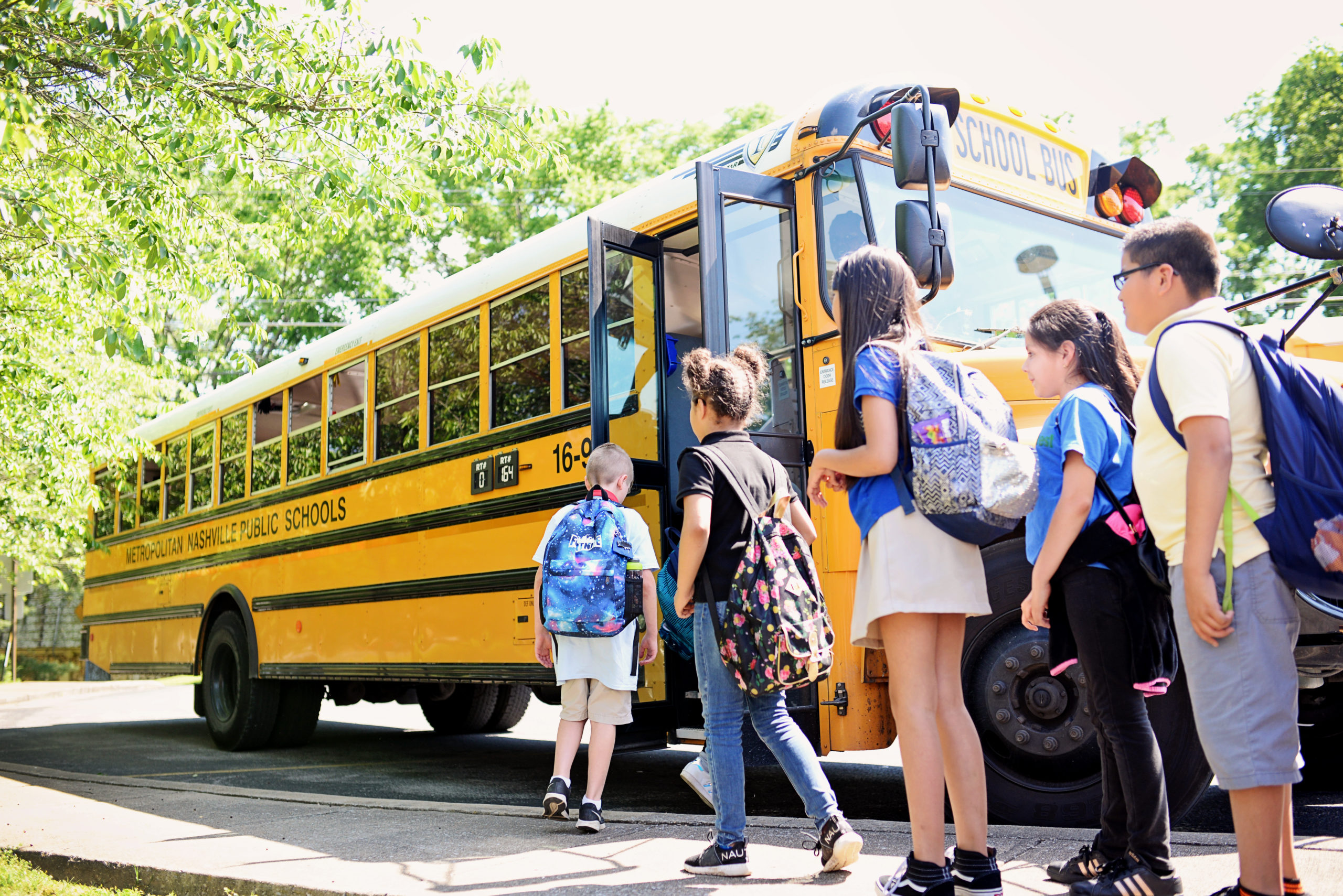 Children entering a school bus